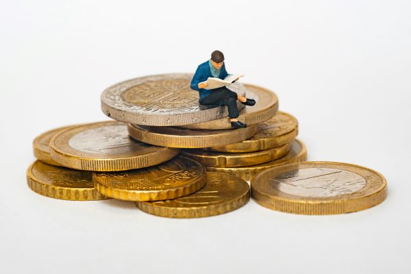 man-sitting-on-coins